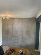 Chicargo Concrete fitted cupboards and drawer installed in a dining room (doors closed), fitted in Billingham